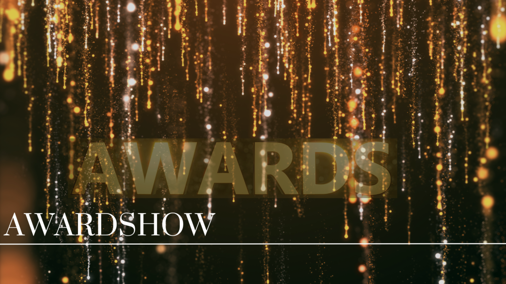 Kollegaer klædt i festtøj på den røde løber til et awardshow.