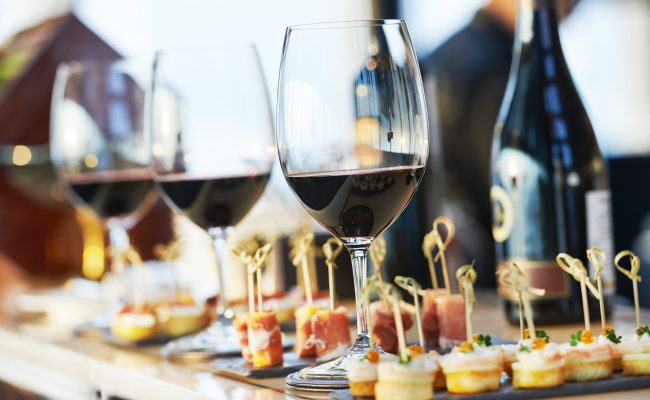 catering services background with snacks and glasses of wine on bartender counter in restaurant